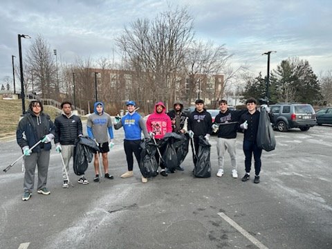 UNH football team cleans up campus neighborhood