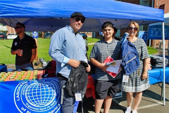 Borer joins Laborers Local Union 455 to give out backpacks to K-12 students